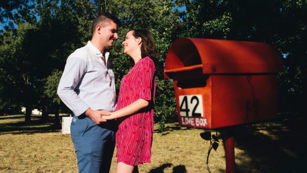 Dan Hills and Bethany Flanagan by the Love Box along the bike path in O'Connor.