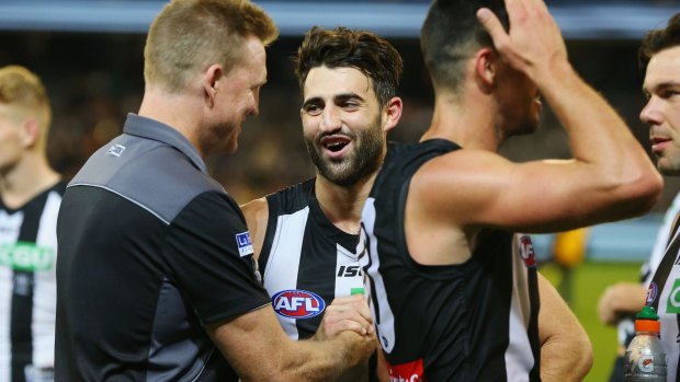Magpie Alex Fasolo with his coach Nathan Buckley.