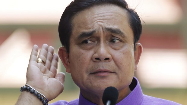 Thai Prime Minister Prayuth Chan-ocha listens to a question from a reporter in Bangkok in March. 
