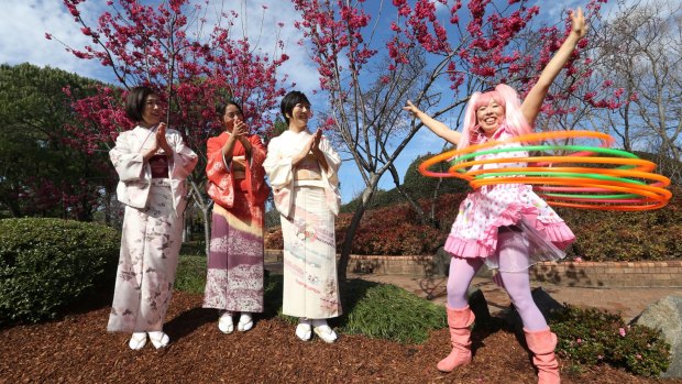 Yuko Yamomoto, Hitomi Kurosawa, Yukie Ota, with Shiho Sparkle Hooper the Hula Hoop performer at the Auburn Botanical Gardens.