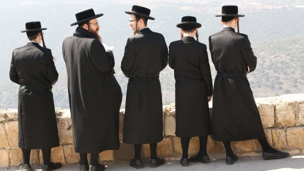 Orthodox Jews pray at the ancient old cemetery.