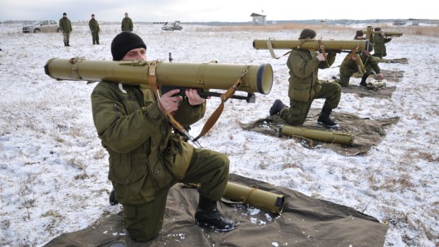 Ukrainian soldiers test their weapons.