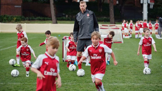 Per-fect day: Per Mertesacker at a coaching clinic for junior footballers at the University of Sydney on Wednesday.