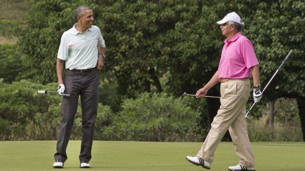 US President Barack Obama, left, plays golf with Najib Razak in Hawaii in 2014.
