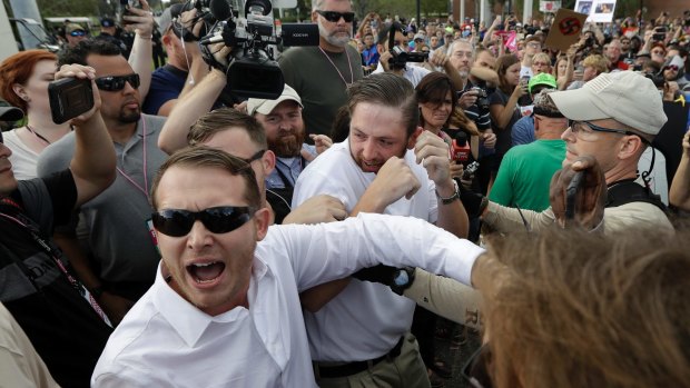 Supporters of white nationalist Richard Spencer clash with a crowd of protesters.