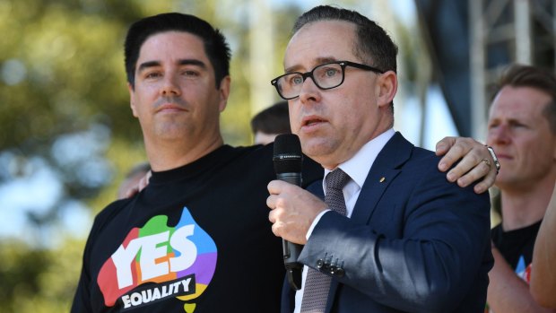 Companies need to "be about more than making money": Qantas CEO Alan Joyce and his partner Lloyd after watching the same-sex marriage vote result.