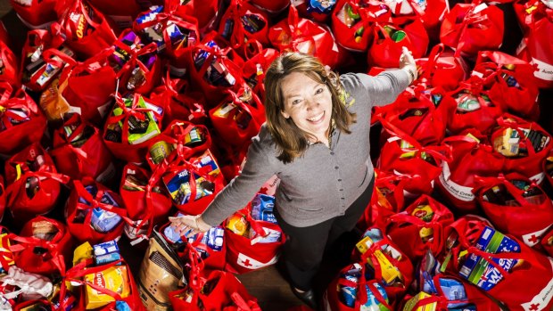 Denise Holehouse, a Red Cross volunteer for five years, will help in delivering some of the 80 food hampers to Canberra asylum seekers this Christmas.
Photo by Matt Bedford.