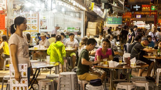 Diners at Temple Street Night Market in Hong Kong.