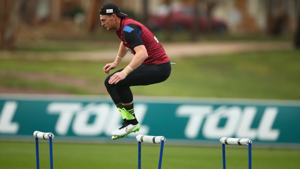 Essendon's Brendon Goddard leaps a hurdle during training on Friday.