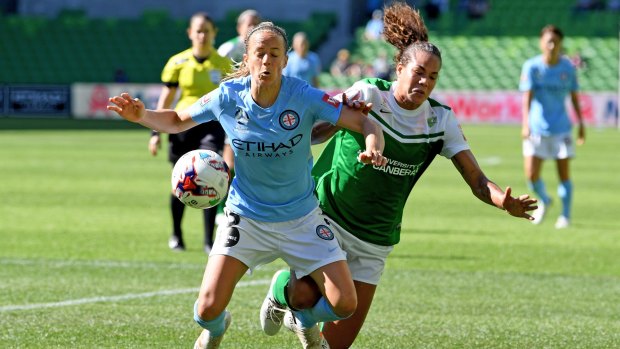Aivi Luik of City (left) and Toni Pressley of United clash, during the round 7 W-League match between Melbourne City and Canberra United.