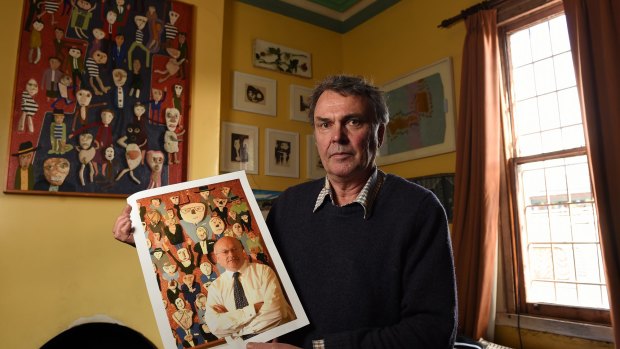 Melbourne artist Bill Hay with a photo of Arts Minister George Brandis posing in front of his painting <i>The Convention</i>. Hay says he refused permission for the senator to use the artwork for his Christmas card.