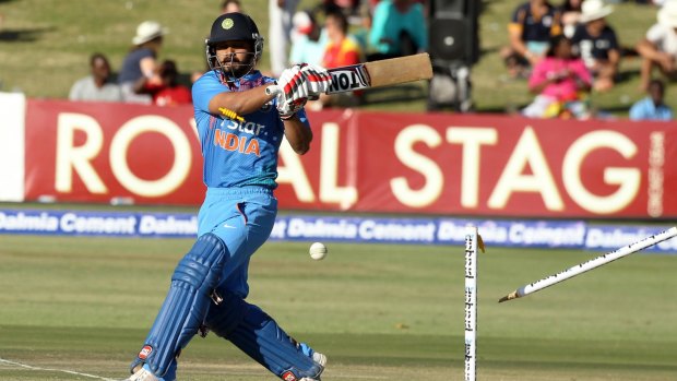 Castle knocked over: Indian batsman Kedar Jadhav is bowled.