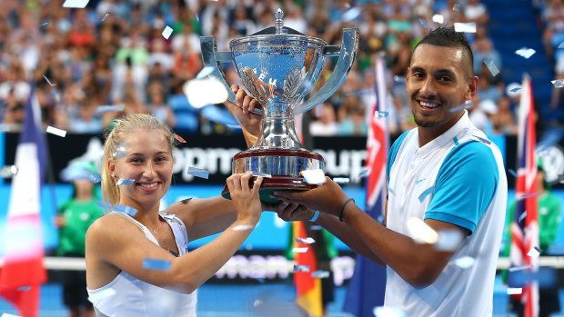 Holding on tight: Daria Gavrilova and Nick Kyrgios with the Hopman Cup.