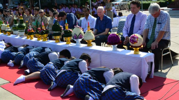 Students pay respect to teachers at a ceremony on June 26, 2015. Peter Dundas Walbran is third from right in the blue short-sleeved shirt.  