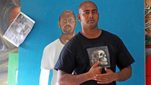 Myuran Sukumaran with a portrait of himself painted by another inmate at Kerobokan during painting classes with Ben Quilty.