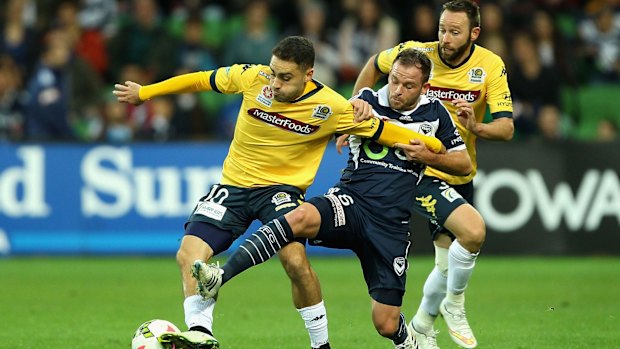 Anthony Caceres of Central Coast (right) and Leigh Broxham of Melbourne compete. 