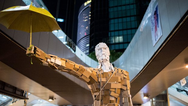 The statue <i>Umbrella Man</i> by the Hong Kong artist known as Milk at a pro-democracy protest site in Hong Kong last year.