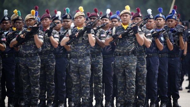 Malaysia's police special-unit members stand in formation in Kuala Lumpur last month. 