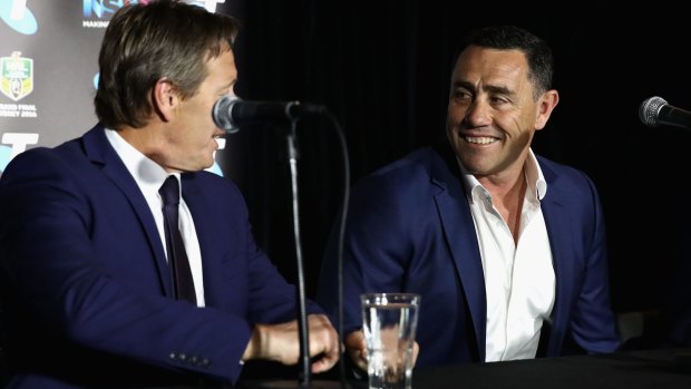 Frenemies: Melbourne Storm coach Craig Bellamy talks to Cronulla Sharks rival Shane Flanagan during the NRL Grand Final press conference at Sydney Opera House on Thursday.