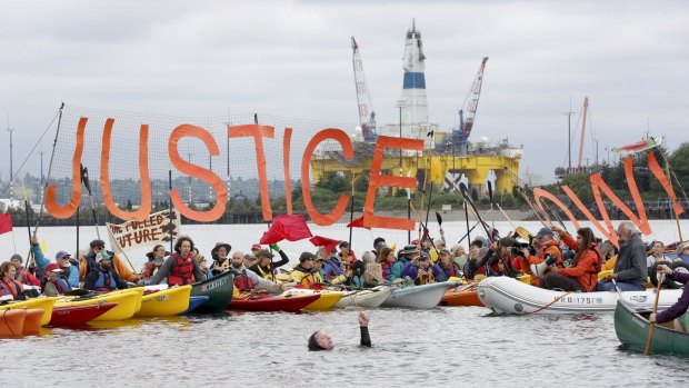 Activists surround Shell's Polar Pioneer at the Port of Seattle to protest arctic drilling.