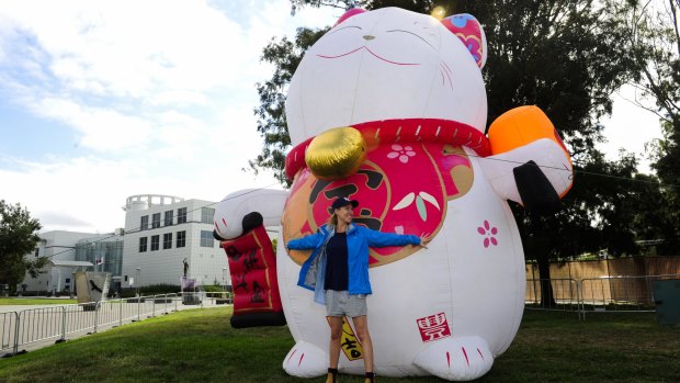 Event manager of operations Alexandra Burgess  with Lucky Cat, who will welcome Canberrans to the Night Noodle Markets from Friday.