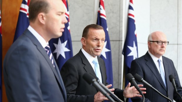 Prime Minister Tony Abbott, pictured with Peter Dutton and George Brandis, stepped up his attack on the ABC on Thursday.