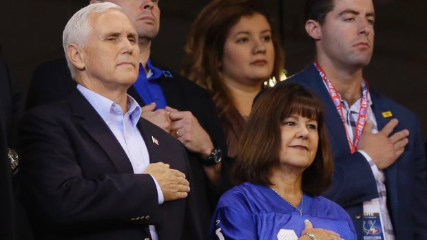 US vice-president Mike Pence and his wife, Karen, stand before the Colts-49ers game.