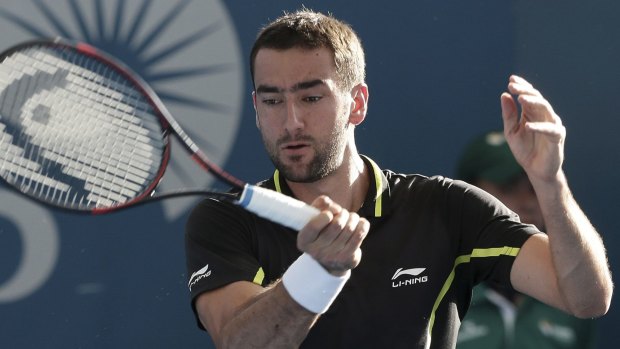 Contender: Marin Cilic of Croatia plays a shot against Dominic Thiem of Austria in the Brisbane International on Friday.