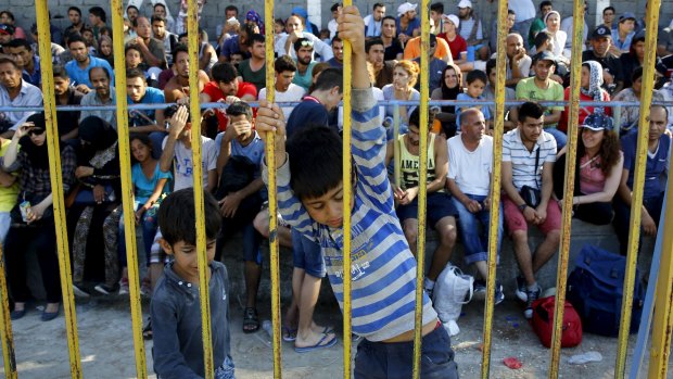 Syrian refugees pack the stands inside the national stadium on the Greek island of Kos. 