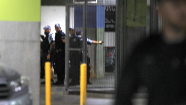 Police search a car park in Maroubra after a police officer was stabbed and a man shot dead.