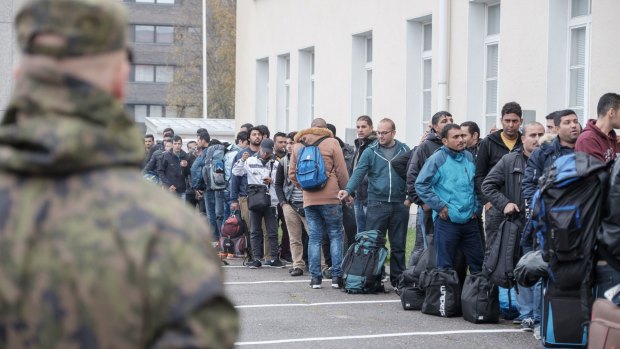 Refugees queue at a reception centre in Tornio, Finland.