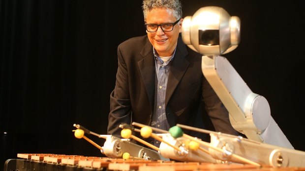 Professor Gil Weinberg with Shimon Robot which improvises jazz at Robotronica.