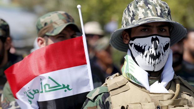 Members of the Shiite militias known as the Popular Mobilisation Units march in Baghdad on July 10.  