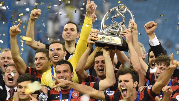 How sweet it is: Wanderers players celebrate winning the AFC Champions League.