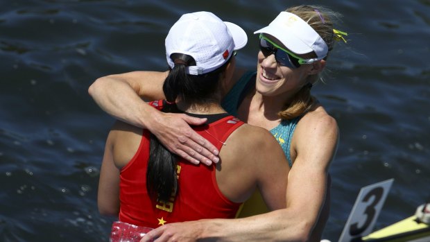 Gold medalist Kim Brennan and bronze medalist Duan Jingli of China embrace after their final at Rio's Lagoa Stadium on Saturday.