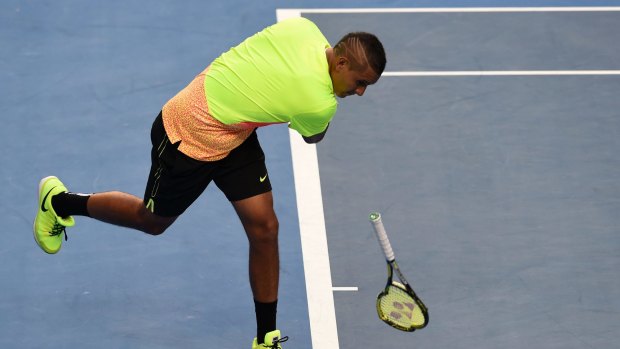 Nick Kyrgios smashes his racquet on court during his match against Andreas Seppi.