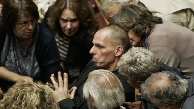Greek Finance Minister Yanis Varoufakis, who is a dual Greek-Australian national, speaks to other lawmakers during a parliamentary session in Athens on Sunday.