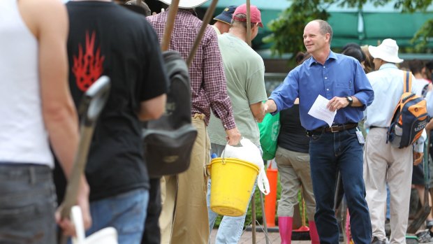 Campbell Newman greets Mud Army volunteers as lord mayor of Brisbane.