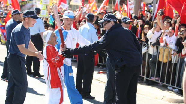 Canberran Stasia Dabrowski completes a leg of the Beijing Olympic torch relay in 2008.