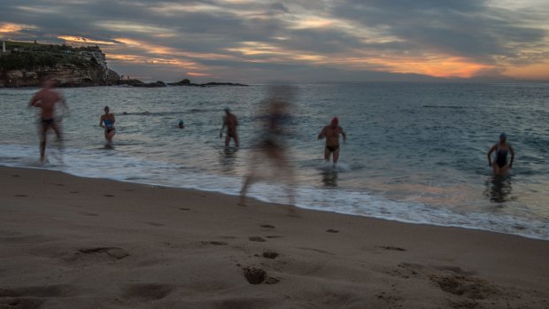 Swimmers enjoy the warm weather at Coogee Beach on Tuesday. 