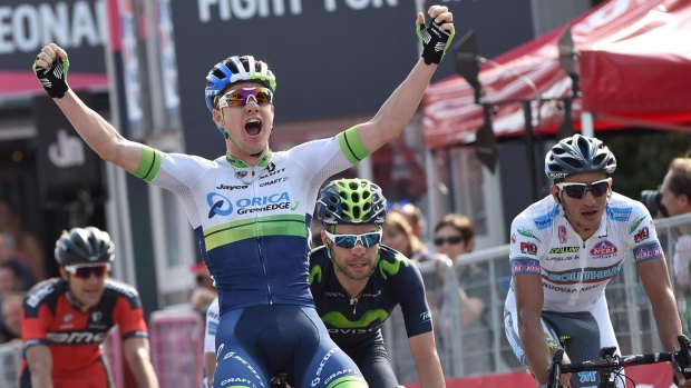 Premature celebration: Simon Clarke rejoices as as he crosses the finish line in the fourth stage of the Giro d'Italia at La Spezia. Italy's Davide Formolo  won the stage after he carried off a perfect solo attack but Clarke took the overall lead.