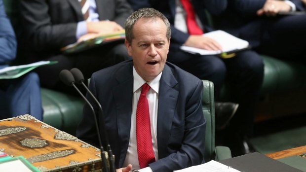 Opposition Leader Bill Shorten listens as Prime Minister Tony Abbott quotes <i>The Killing Season</i> during question time.