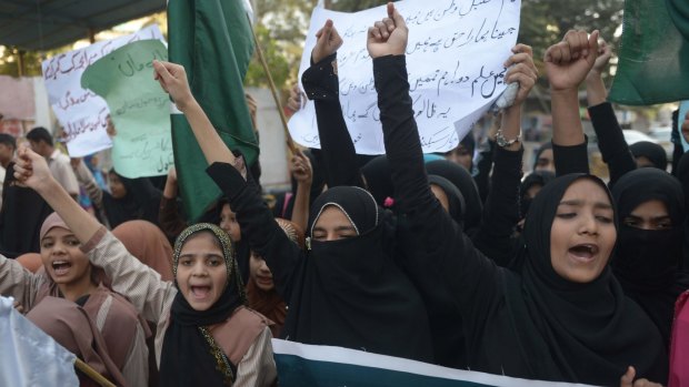 Pakistani students demonstrate against the Taliban in Karachi on Saturday.