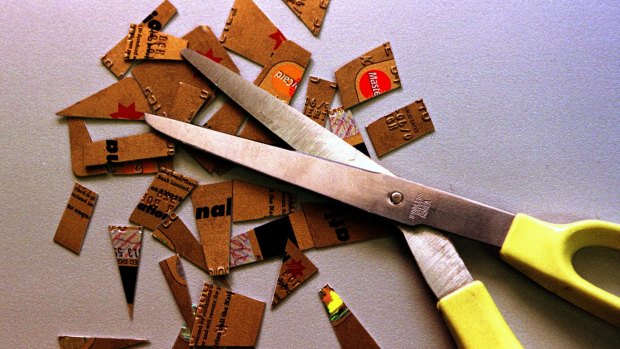 Simple solution: Curb your spending by cutting up your credit cards.