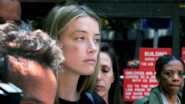 Actress Amber Heard leaves Los Angeles Superior Court in May, after giving a sworn declaration that her husband Johnny Depp threw her mobile phone at her during a fight, striking her cheek and eye.