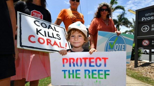 Anti-Adani coal mine protesters demonstrate outside the Proserpine Hospital as Queensland Premier Annastacia Palaszczuk visits on Monday.