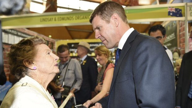 NSW Premier Mike Baird meets a woman at the Royal Easter Show who expressed concerns about the possible lease of the state's power network to China. 