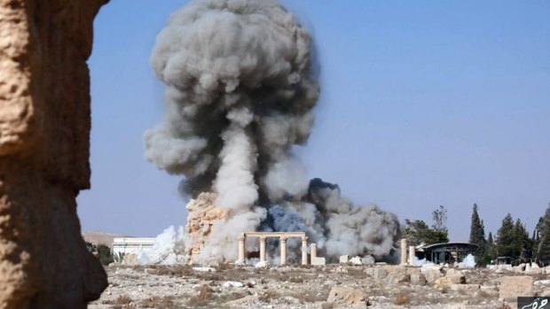 Smoke rises after Islamic State blew up the 2000-year-old temple of Baalshamin in Palmyra in August. 