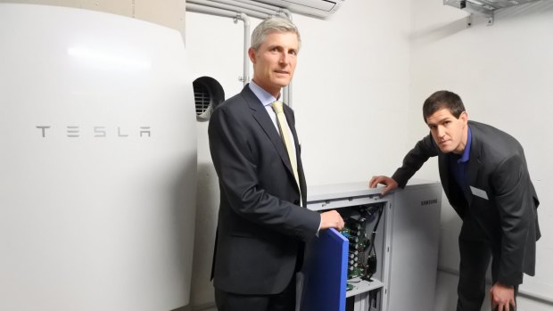 ARENA chief executive Ivor Frischknecht and ITP Renewables' managing director Simon Franklin with the Samsung All In One 10.8kWh battery and the Tesla Powerwall battery, which will both be tested at the CIT's new Lithium-ion Battery Test Centre