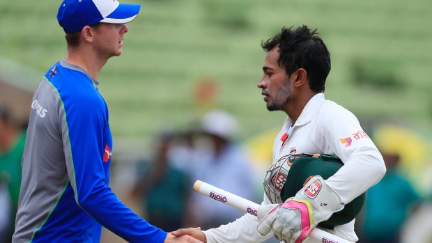 Bangladesh's captain Mushfiqur Rahim shakes hand with Australian captain Steve Smith.